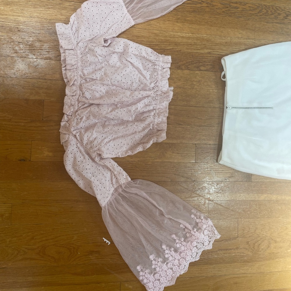 pink off the shoulder top with flared sleeves and embroidery details